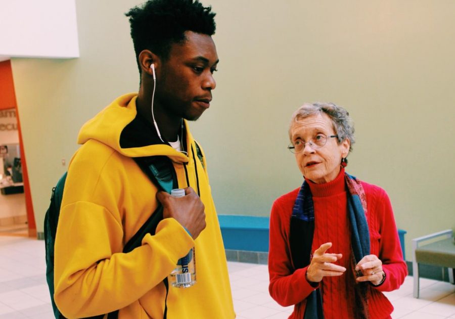 Cathy Henderson, a volunteer of the Board of Elections, clarifies  information about elections 
 for a Montgomery College student.