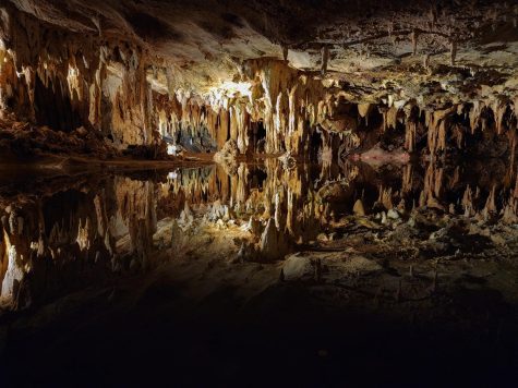 In the Dream Lake area, the water mirrors the collection of hanging stalactites within the cavern.