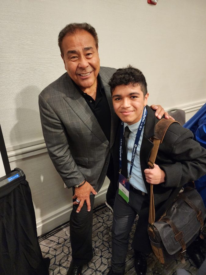 (left to right) John Quinones, host of the show What Would You Do?, and MC Excalibur photographer Diego Larin pose at the SPJ conference.