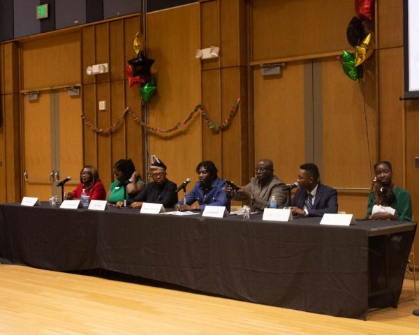 The Panelists (Left to right, Remi Duyile, Keyna Anyiam, Ivo Tasong, Kadmiel Van Der Puije, Jewru Bandeh, Yoseph Zerihun, Yamundow Sarr) do a mic check before starting the Q&A session.