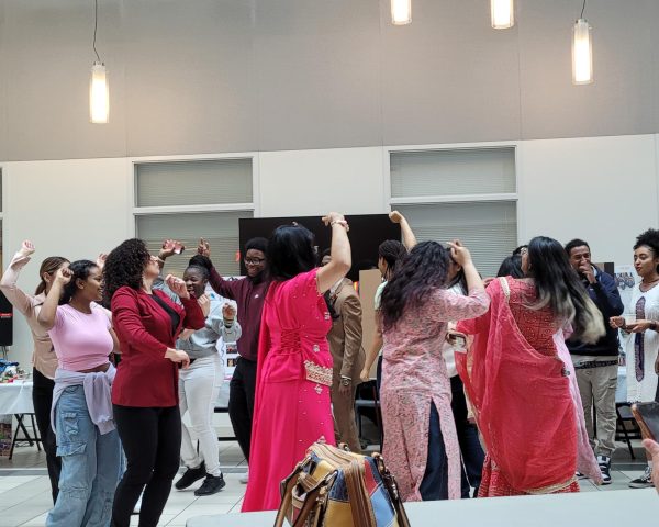 Students come together to unite different cultures through dance at the Multicultural Fair hosted in the ST Atrium.