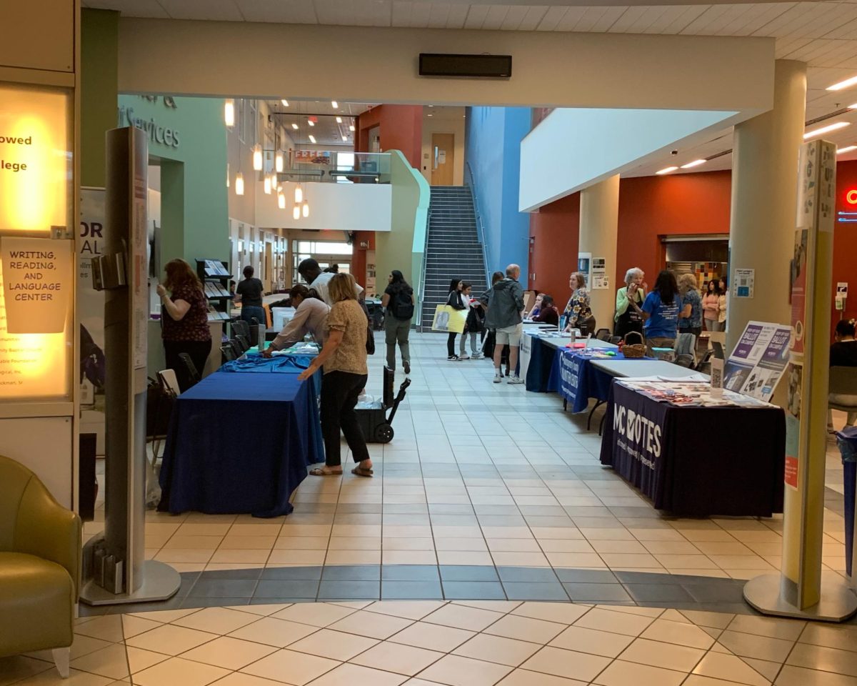 Volunteer organizations set up tables to offer opportunities to attendees at the fair.